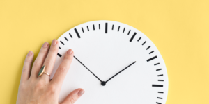 Hand and Clock - blog post header - How to schedule Pins to Pinterest