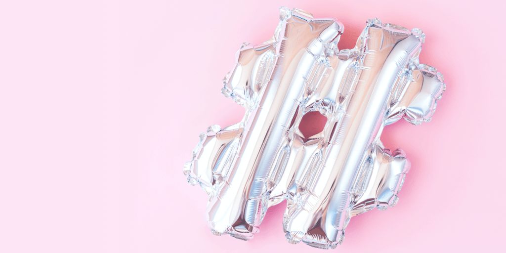 silver hashtag on pink background - header image for the best hashtags on instagram and how to find them