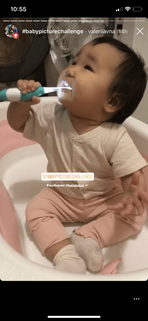 Baby holding toothbrush on Instagram Stories