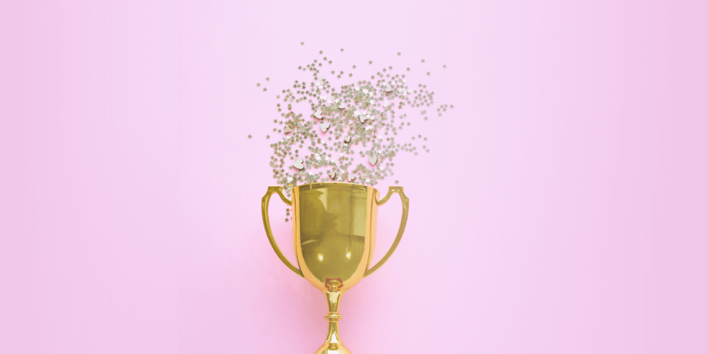 Instagram Story Challenges header - gold trophy on pink background with glitter spilling out