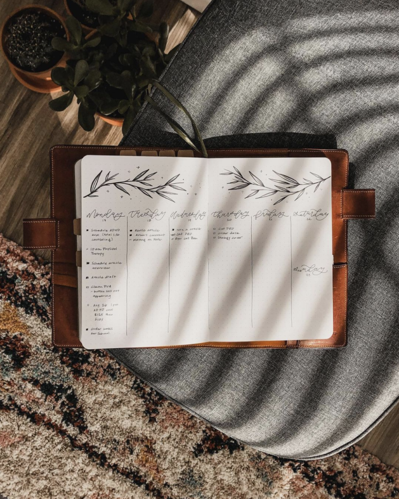 journal on grey chair in dappled light