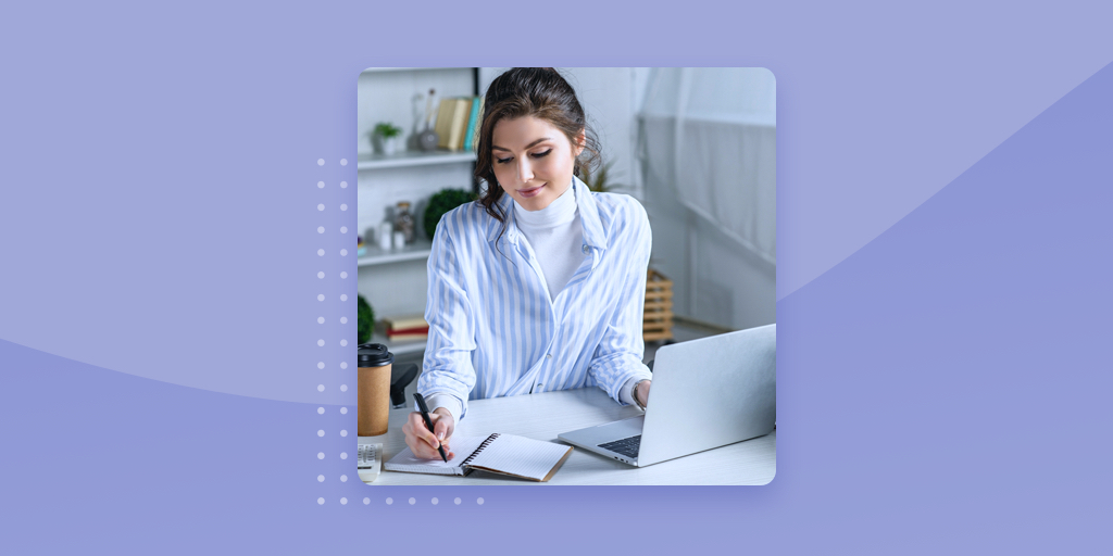 Woman on computer on lavender background