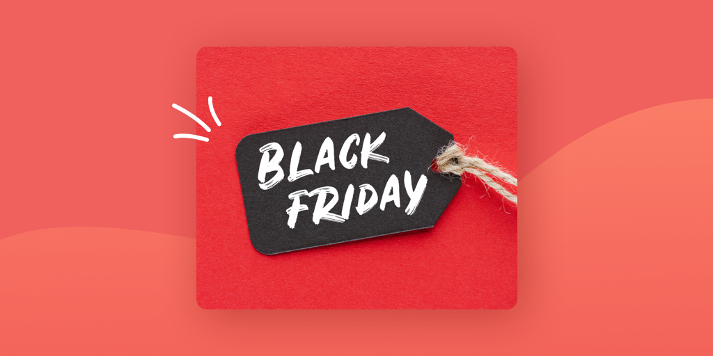 A black gift tag with Black Friday written on it in white marker on a red background